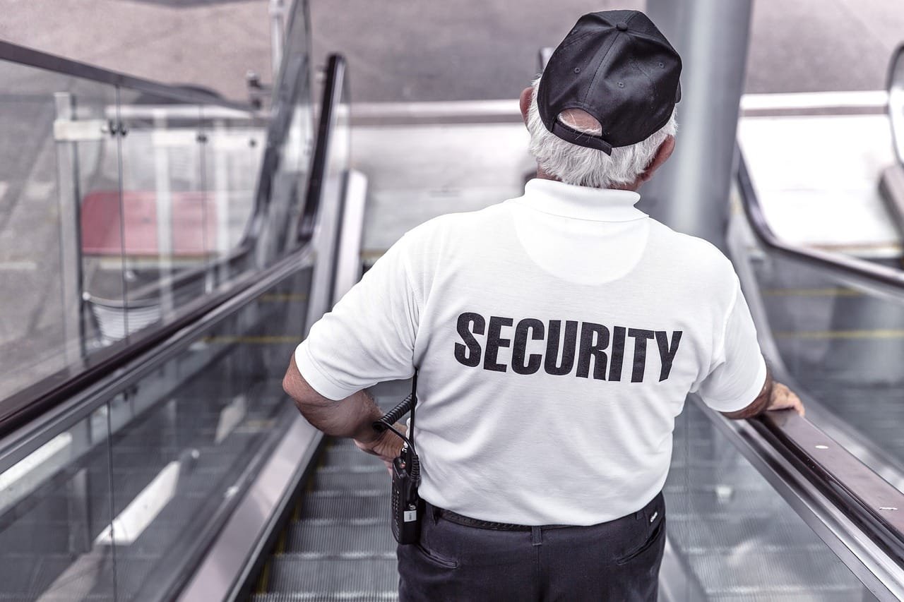 Madge Mansions 2 security, man, escalator, police, guard, officer, surveillance, control, monitoring, safety, uniform, back view, security, security, security, security, security, police, safety